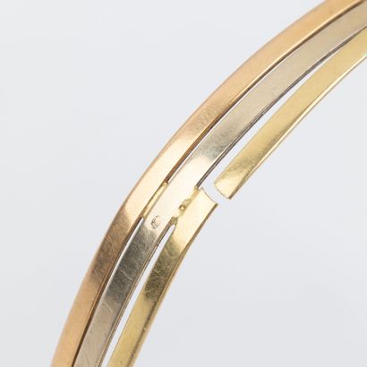 Three 18K gold open half-brace bracelet 
Weight:...