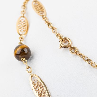 Sautoir in 18 K filigree gold, punctuated...