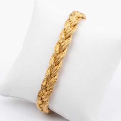 Bracelet in 18 K gold, plaited mesh 
Weight:...