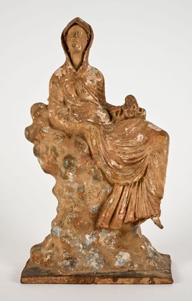Statuette depicting a draped young woman...