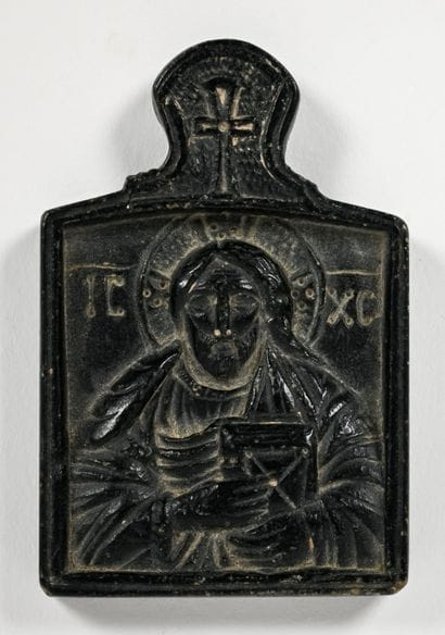 Plaque decorated with a bas-relief depicting...
