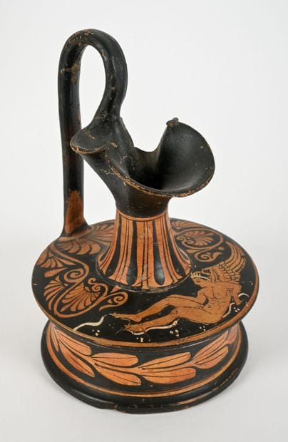 Red-figure epichysis, in the Apulian style...