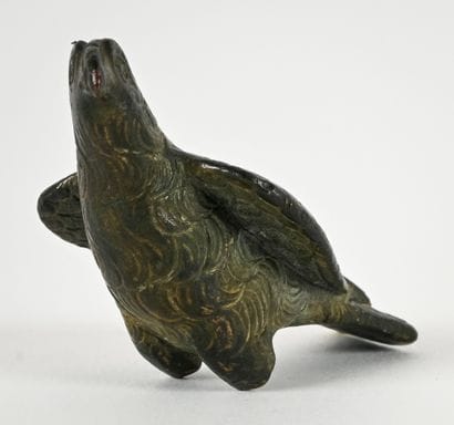 Statuette depicting an eagle with folded...