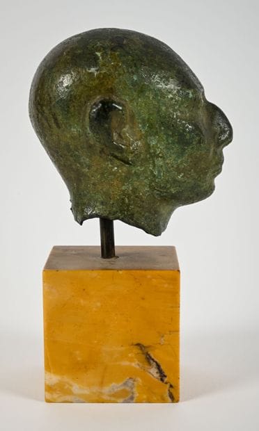 Head depicting the portrait of a priest with...