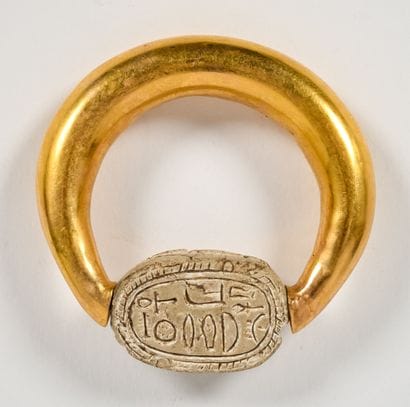 Large, domed ring adorned with a scarab whose...