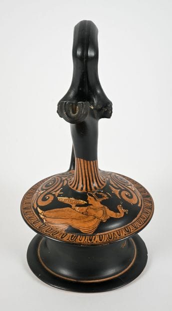 Red-figure epichysis with a figure of a seated...