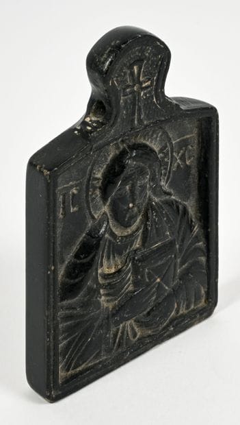 Plaque decorated with a bas-relief depicting...