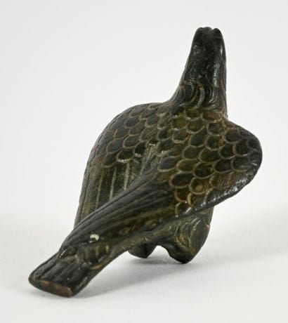 Statuette depicting an eagle with folded...