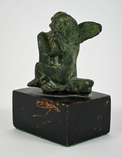Statuette depicting the god Eros seated 
Bronze...