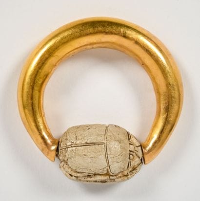 Large, domed ring adorned with a scarab whose...