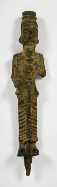 Statuette depicting a dignitary holding a...