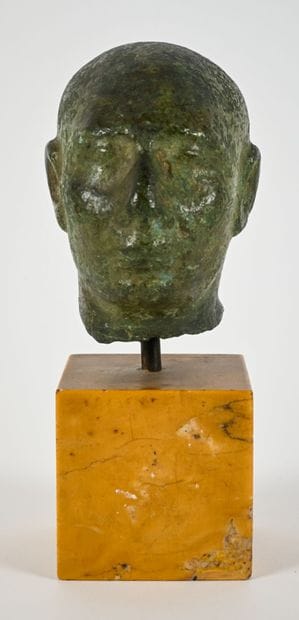 Head depicting the portrait of a priest with...