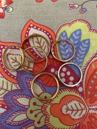 Six yellow gold wedding rings, one of which...