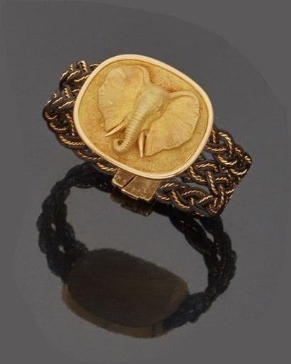 Leather and yellow gold bracelet (18k) decorated...