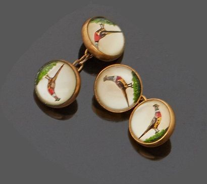 Pair of gold metal cufflinks representing...