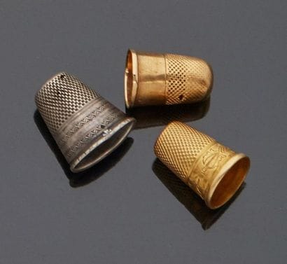 Two 18 k (750 thousandths) yellow gold dressmaker's...