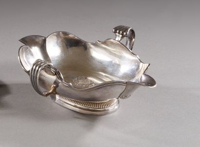 Plain silver sauce boat on a pedestal with...