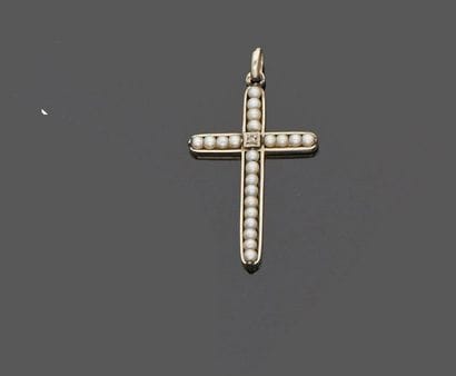 Cross in 18 k (750 thousandths) white gold...