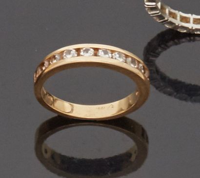 American half wedding ring in 14 k (585 thousandths)...