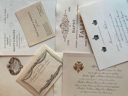 Business cards, invitations and papers with...