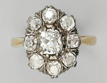 Bague rosace en or jaune et or gris sertie...