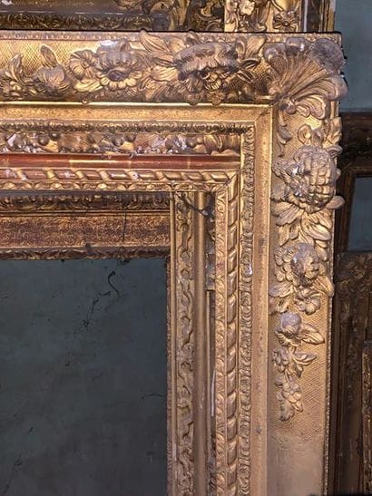 Two gilded and carved wooden frames, one...