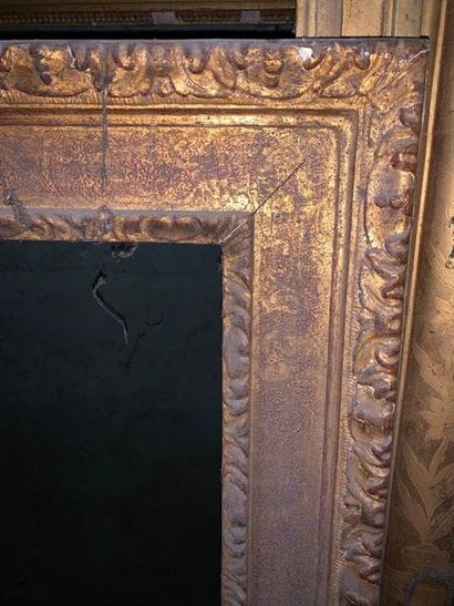 Two wood and gilded stucco frames with flat...