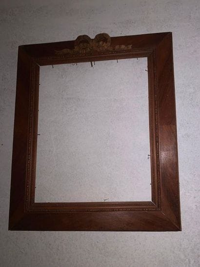 Carved natural wood frame decorated with...