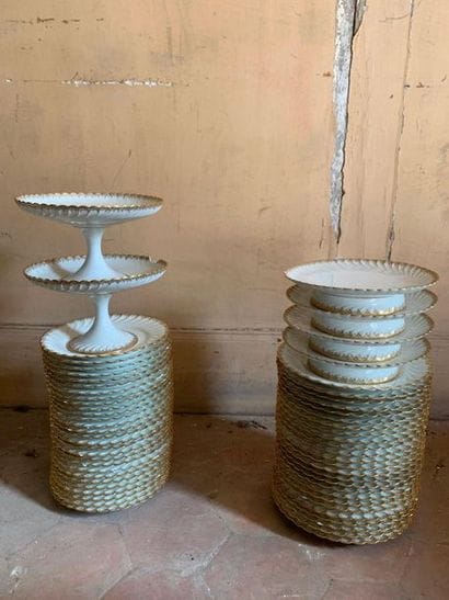 White porcelain dinner service with gilded...