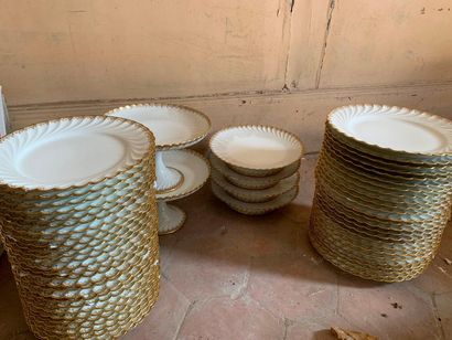 White porcelain dinner service with gilded...