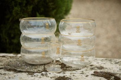 Six crystal goblets with gold rim decorated...