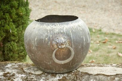 Metal basin, bronze socket with stylized...