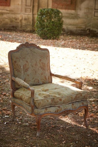 Large armchair corner of fire with a flat...