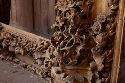 Important frame in carved stuccoed wood and...