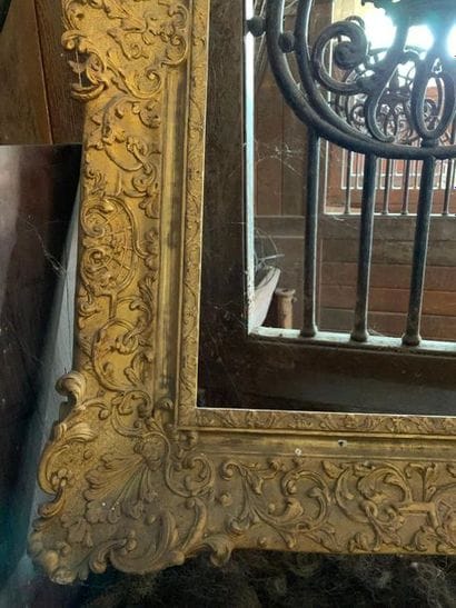 Large wooden and gilded stucco frame with...