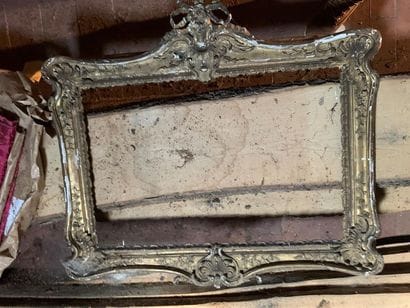 Carved and gilded wood frame with ribboned...