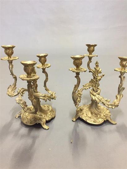 Two sclupted and gilt bronze candelabra with...
