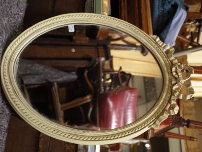 White lacquered resin oval mirror in the...