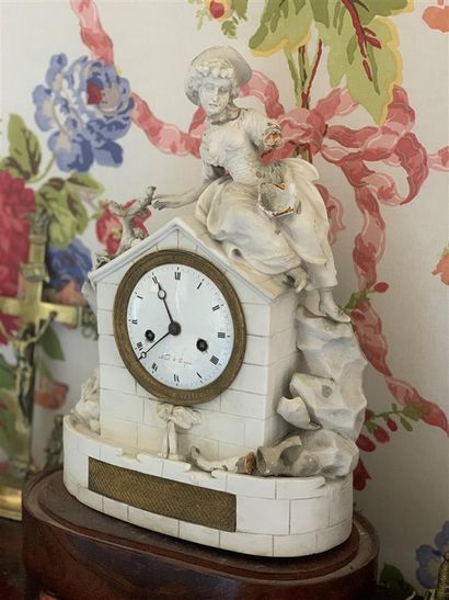 Biscuit clock, the white enamelled dial signed...