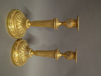 Two bronze torches in the Louis XVI style,...