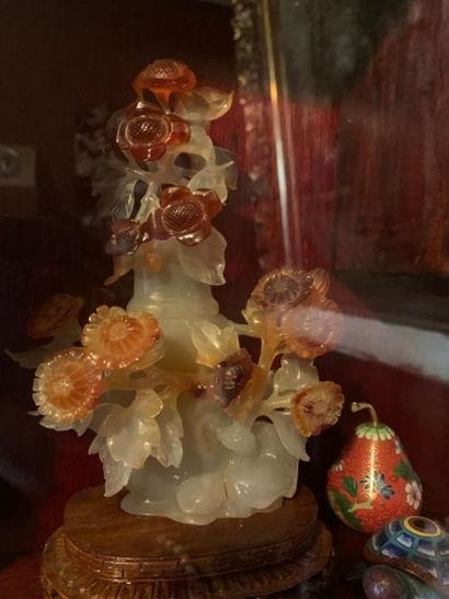 Carved hard stone vase with flower decoration...