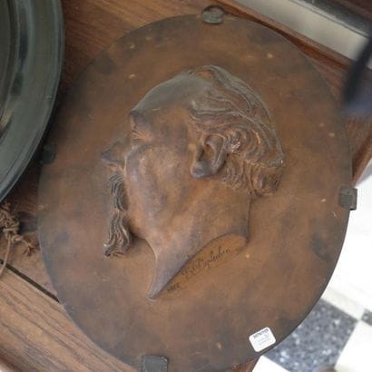 Three coloured plaster profiles of Napoleon...