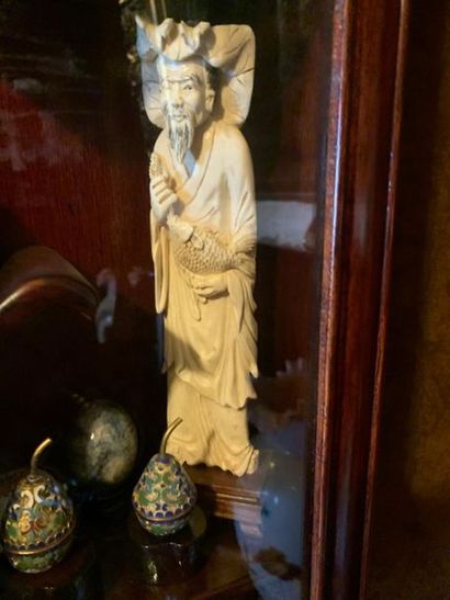 Okimono ivory statuette carved bearded fisherman.

Asian...