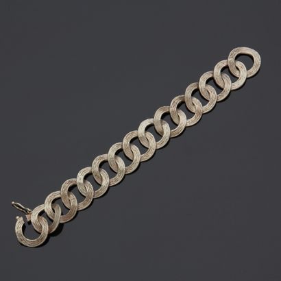 Bracelet en argent à décor de disques entrelacés...