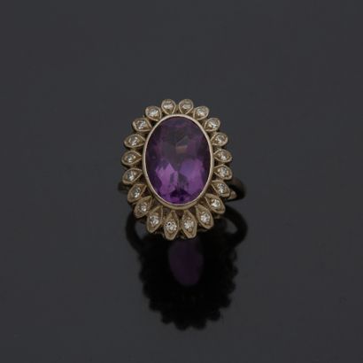 Bague en or gris 18 k (750 millièmes) sertie...