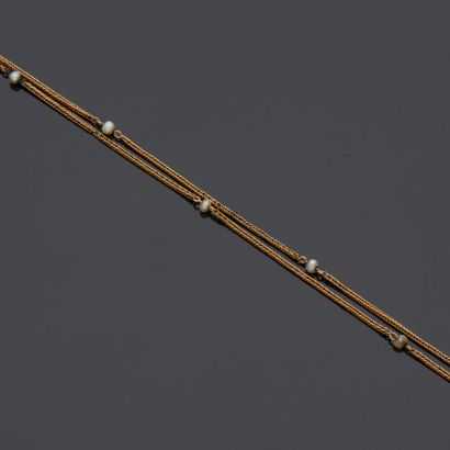 Chaîne de montre en or jaune 18 k (750 millièmes)...