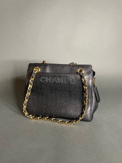 
CHANEL

Black calfskin bag, front embroidered...