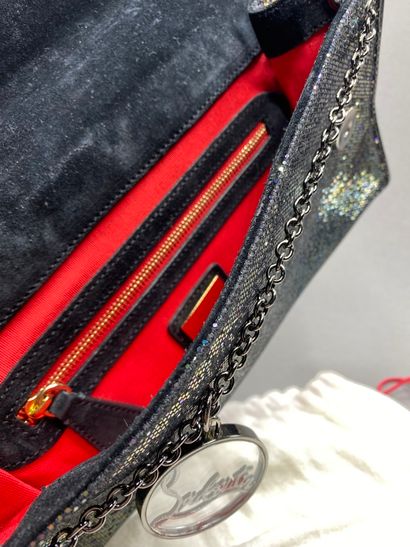 Christian LOUBOUTIN

Pochette en cuir verni...
