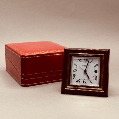 CARTIER

Square clock with Roman numerals...