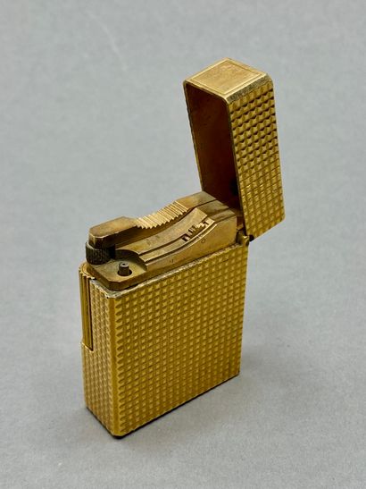 DUPONT

Three gilded metal lighters, one...